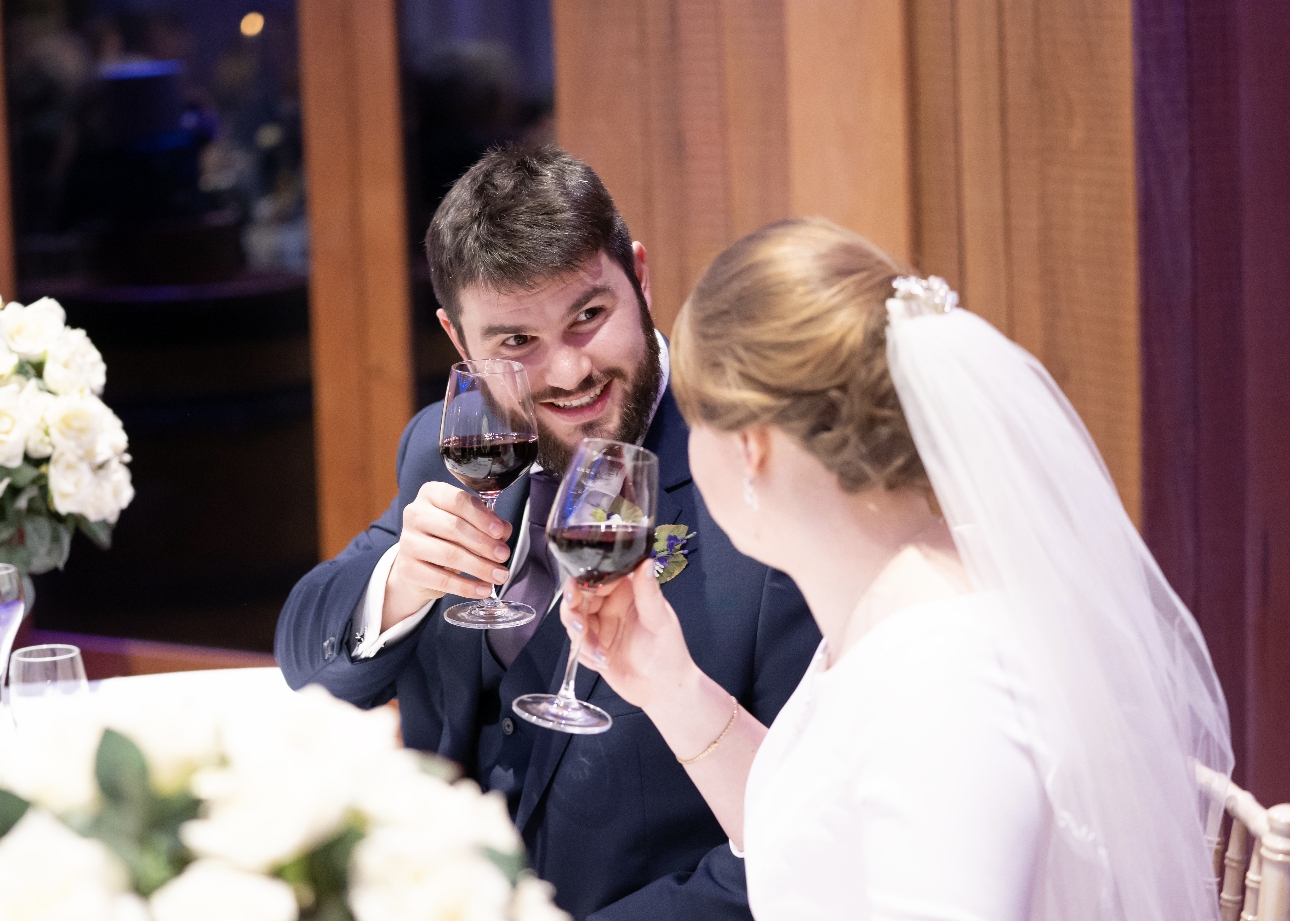 Couple enjoy a glass of red