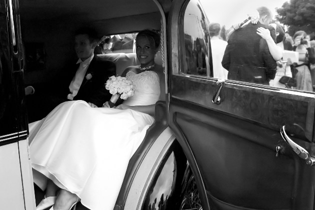 Couple in wedding car