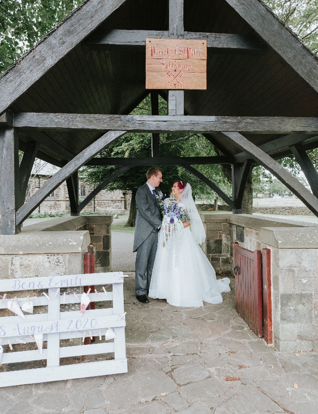 Bride and groom meet in the church grounds