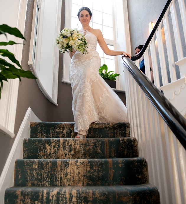 Bride walking down stairs
