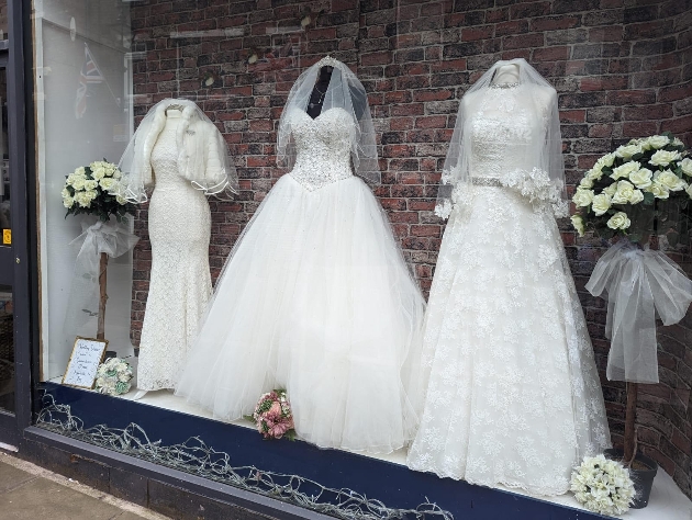 St Ann’s Hospice’s Bridal and Vintage Store's window full of wedding dresses