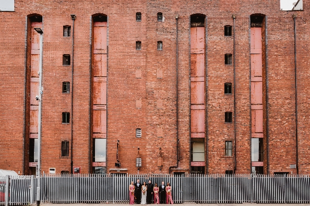 A wedding party standing outside Victoria Warehouse