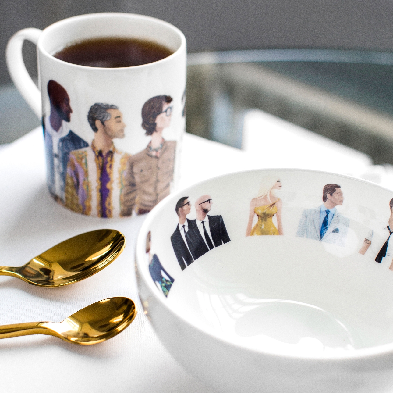 white china mug and bowl with iconic figures in the design