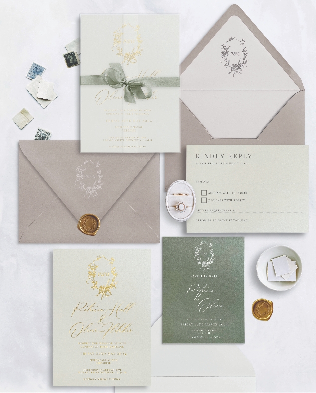 A green and grey wedding stationery set