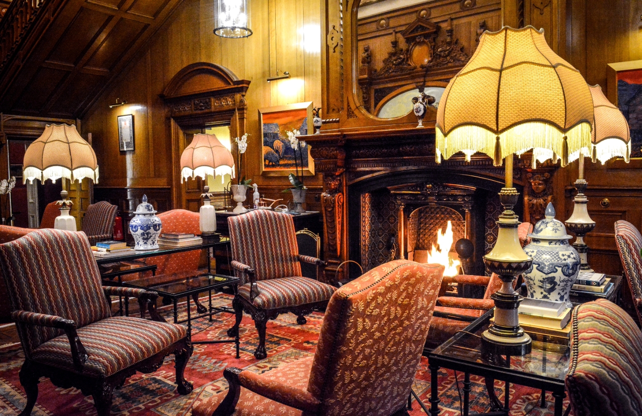 oak panelled lounge with fire 