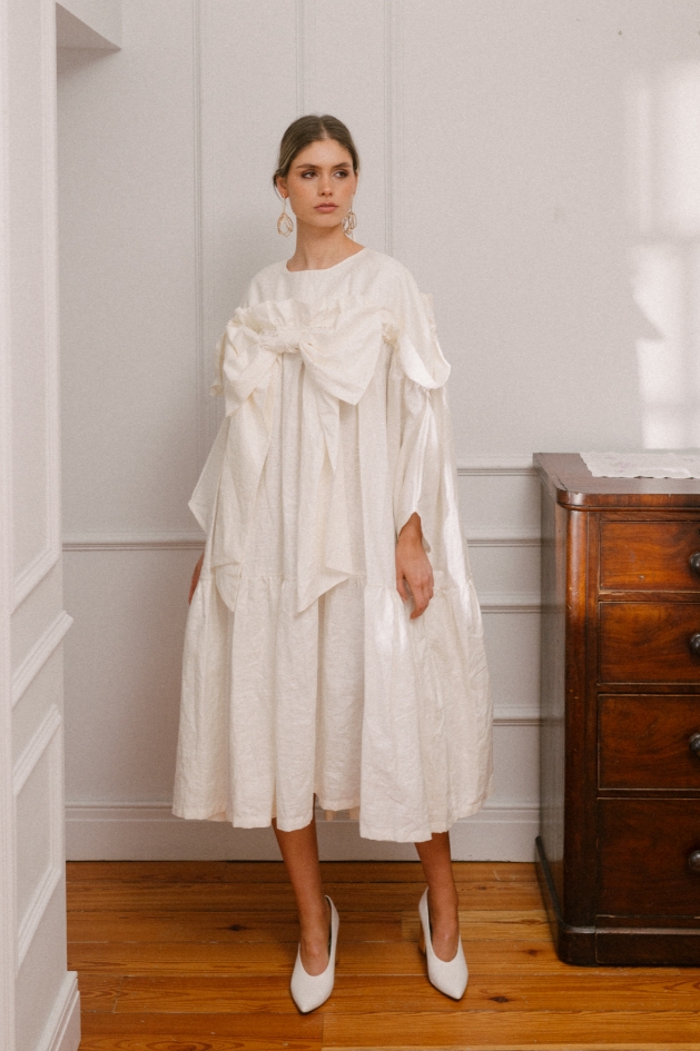 woman in oversized white dress