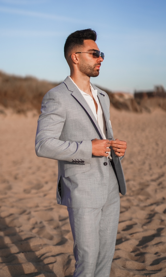 pale great suit, worn by man on beach