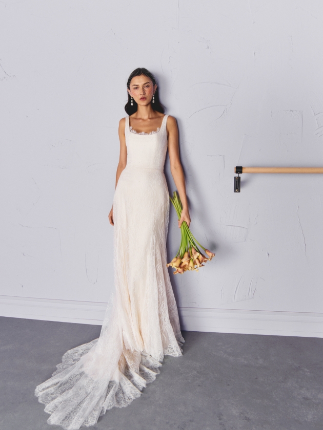 woman in long wedding dress posing in ballet studio