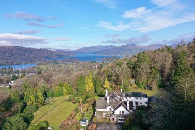 An aerial view of Lindeth Fell surrounded by hills and trees