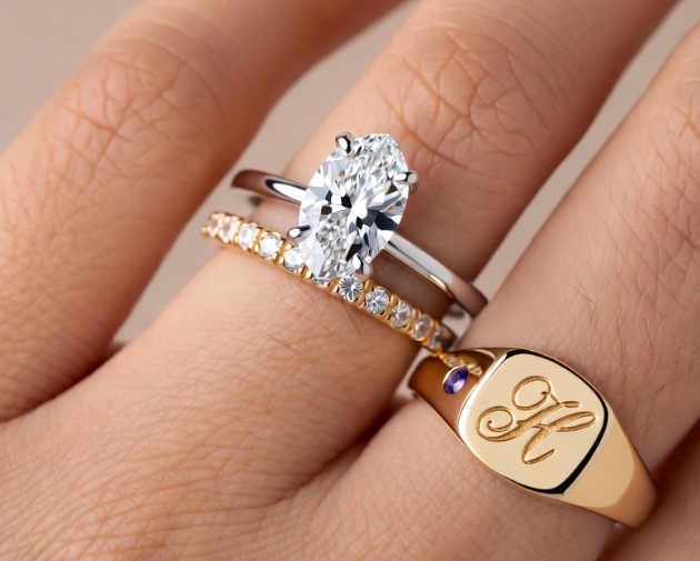 engagement and wedding bands worn on ring finger an initial or signet ring on Pinky